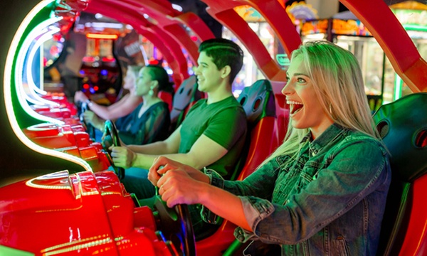 People having fun playing arcade games at Outta Boundz