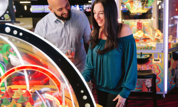 Couple enjoying arcade games on a date night