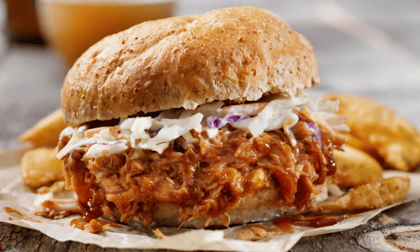 Pulled pork sandwich with coleslaw and fries